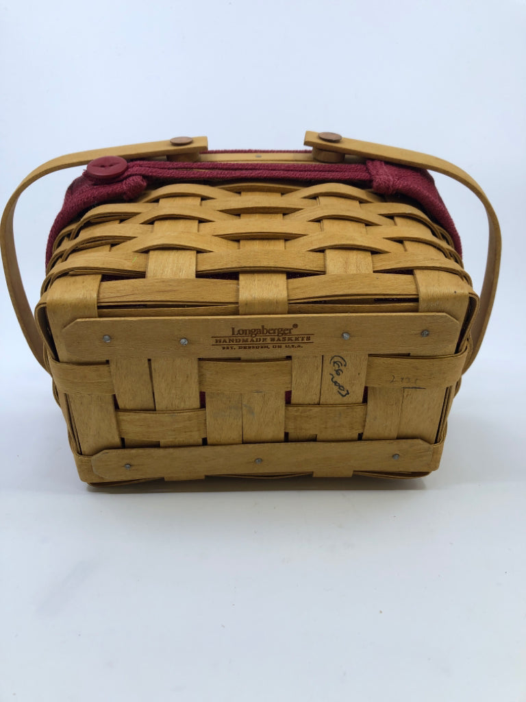 SMALL RECTANGLE BASKET W RED AND PLASTIC LINER AND 2 HANDLES.