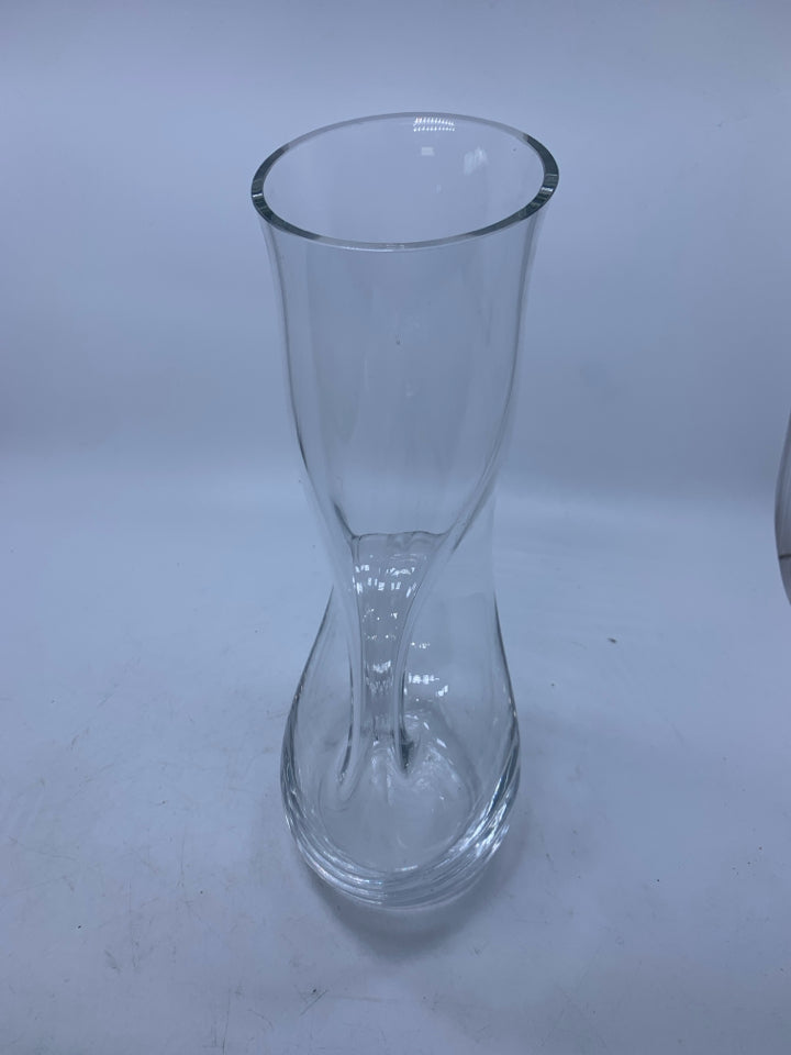CLEAR GLASS PITCHER W/ CIRCLE HANDLE THROUGH CENTER.