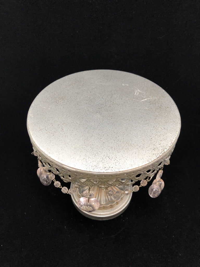 RAISED METAL CAKE STAND W/DANGLE HEART CHARMS.