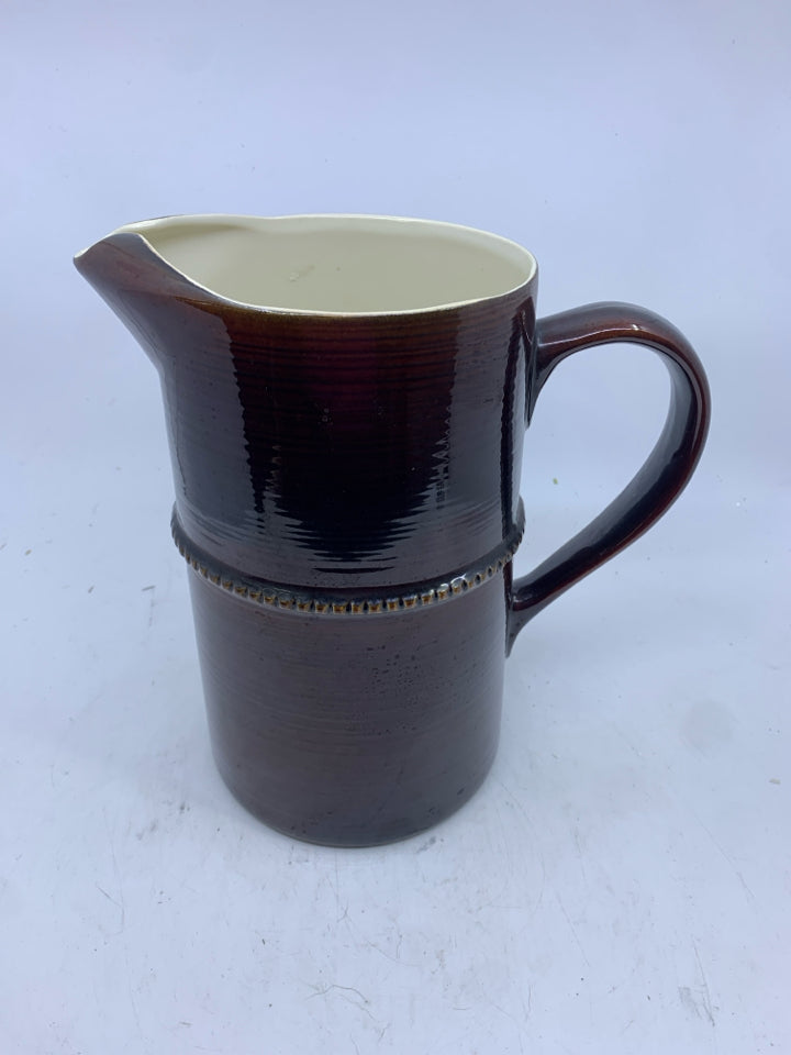 BROWN CERAMIC PITCHER.