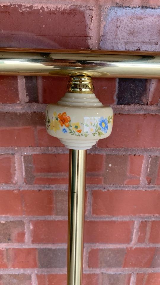 BRASS TWIN BED FRAME W/CERAMIC FLORAL BALL DETAILS.