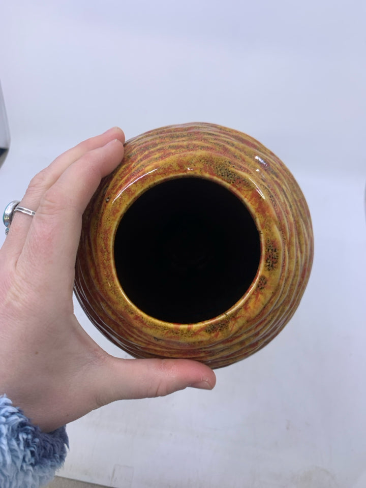LARGE RED/YELLOW TEXTURED VASE.