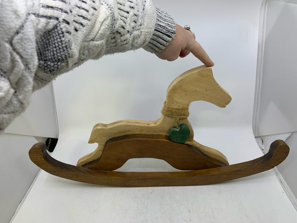 WOOD PRIMITIVE STYLE ROCKING HORSE W/ GREEN HEART AROUND NECK.
