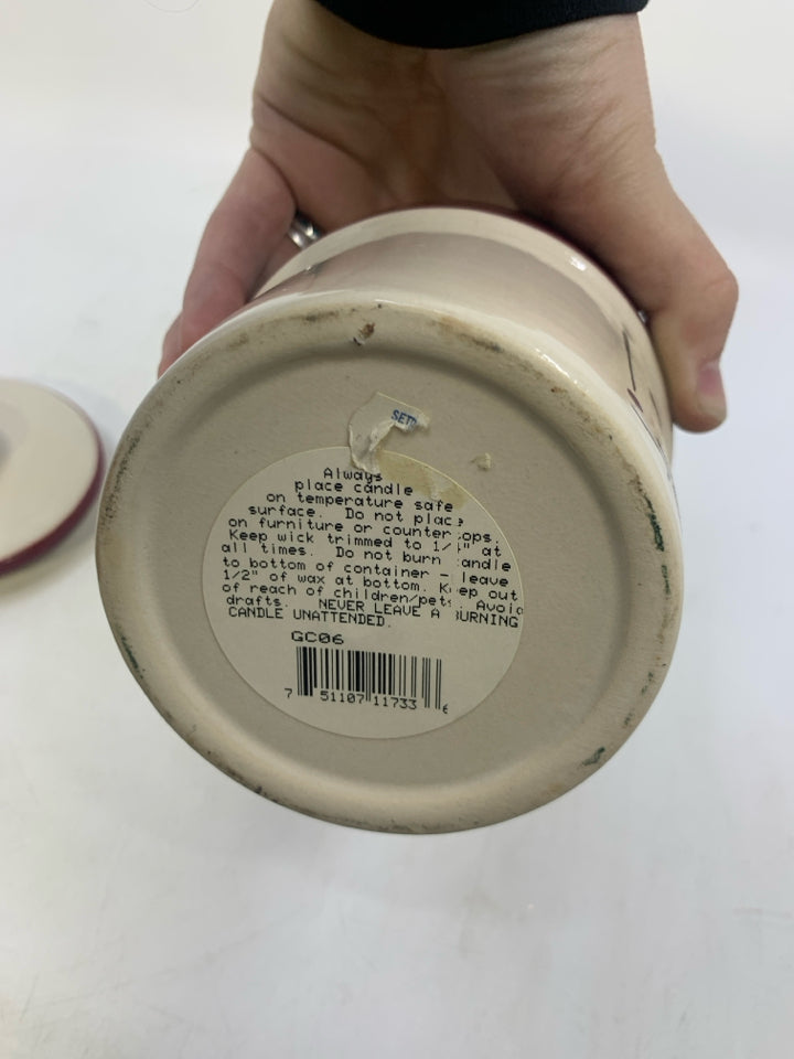 CHIVE CANISTER W/ CANDLE INSIDE.