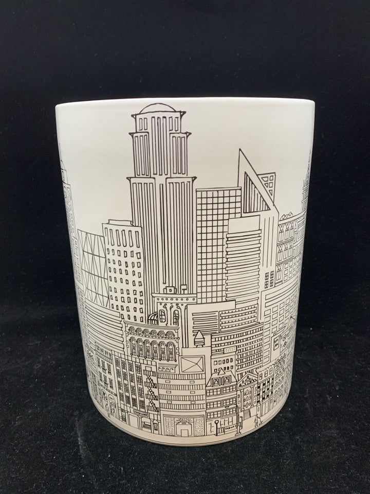 CERAMIC CITY TRASH CAN.