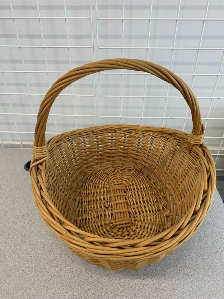 OVAL WICKER BASKET W/LARGE HANDLE.