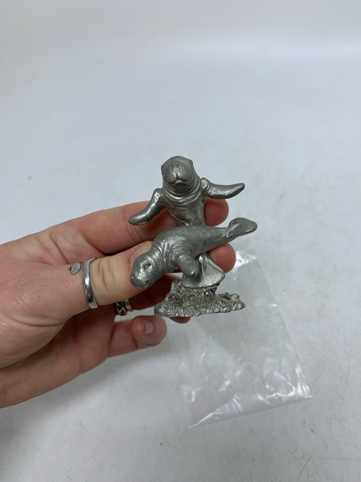 PEWTER DOUBLE MANTEE FIGURINE.