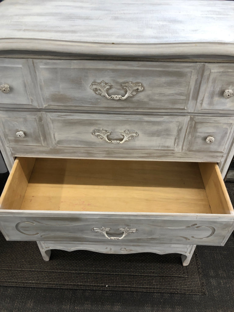 DISTRESSED WHITE WOODEN DRESSER.