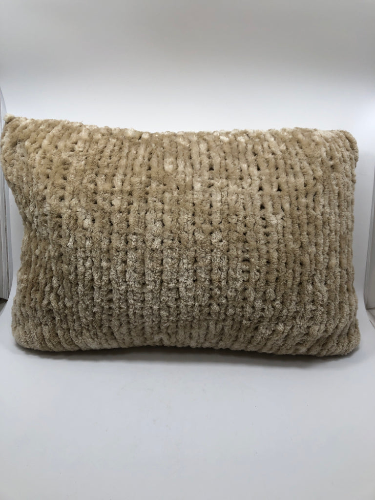 FUZZY TAN THROW PILLOW.