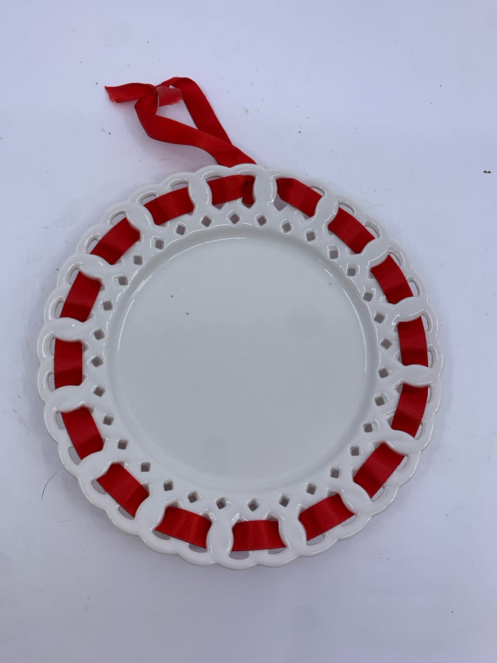 2 MILK GLASS RED RIBBON WALL ART.