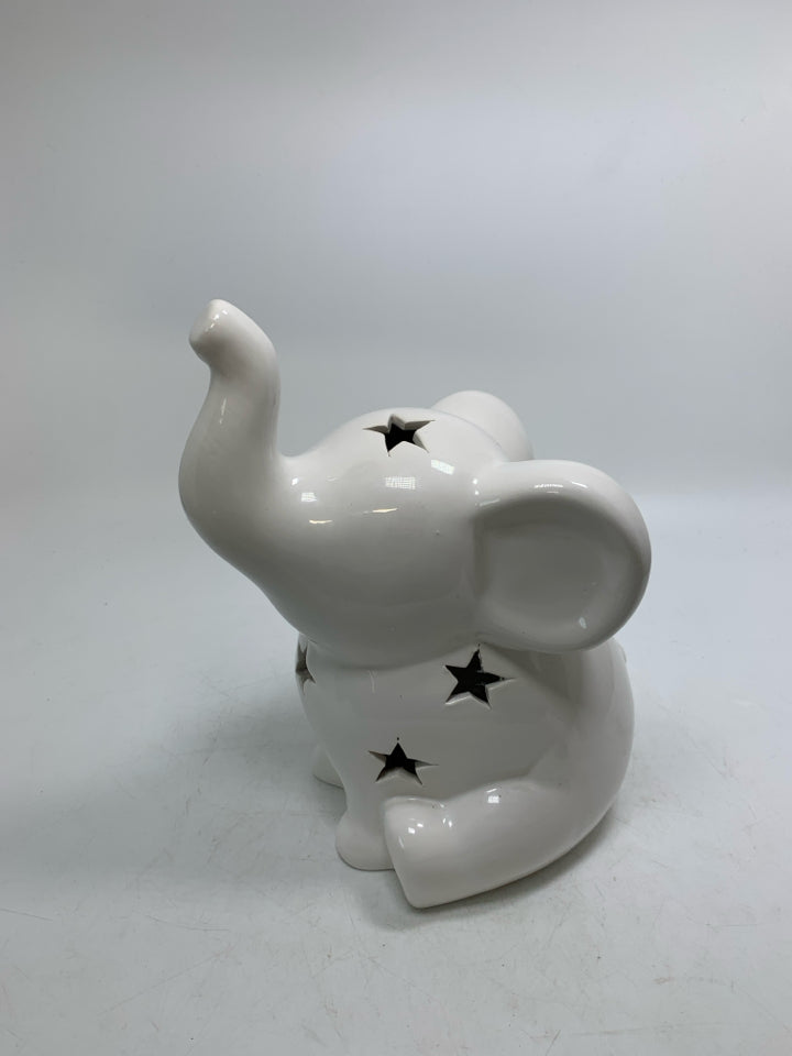 WHITE CERAMIC SITTING ELEPHANT W/ PIERCED STARS.