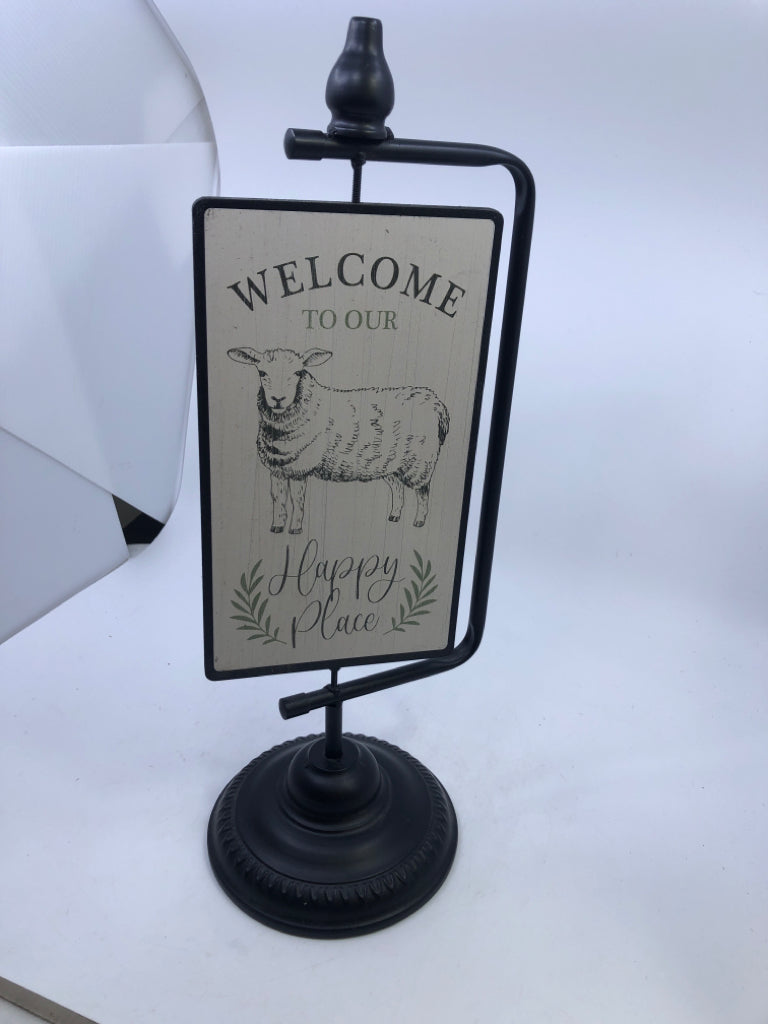 2-SIDED SIGN WELCOME TO OUR HAPPY PLACE SHEEP W/BLACK METAL BASE.