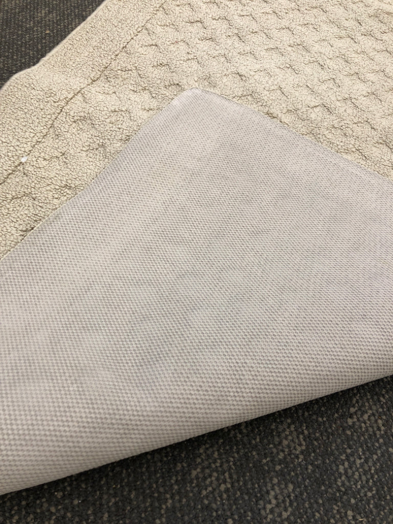 TAN RUG.