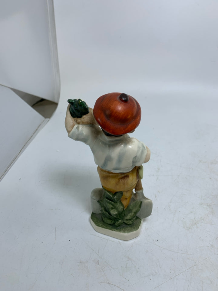 VTG FRIEDEL GERMAN MAN HOLDING RADISH.