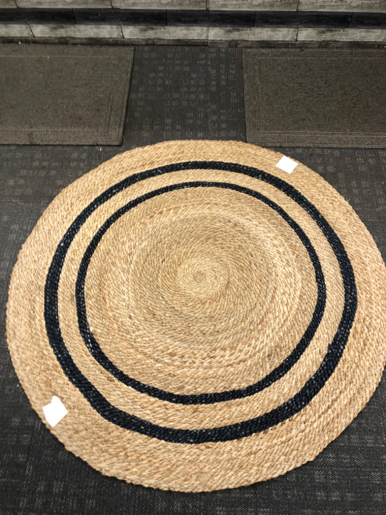 BLACK STRIPED WOVEN JUTE AREA RUG.