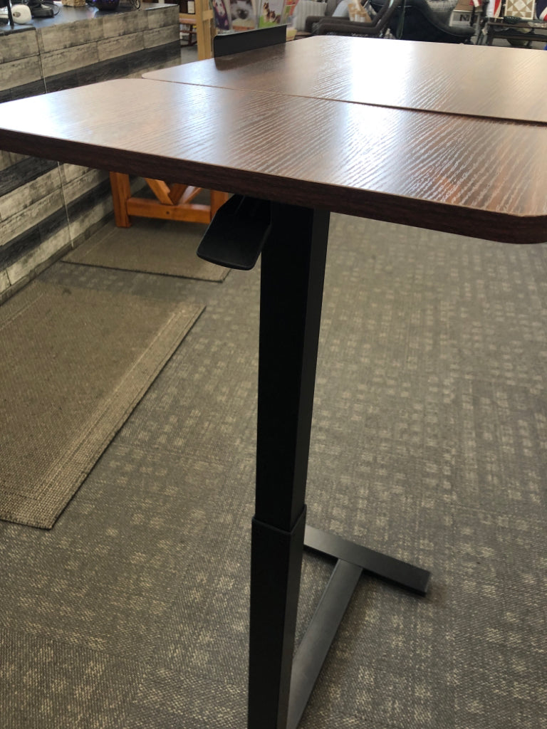 BROWN ADJUSTABLE DESK ON WHEELS.