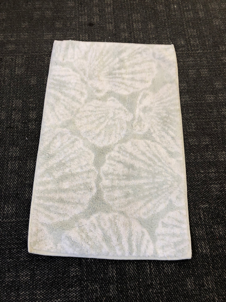 PALE BLUE SEASHELL PRINT BATH RUG.