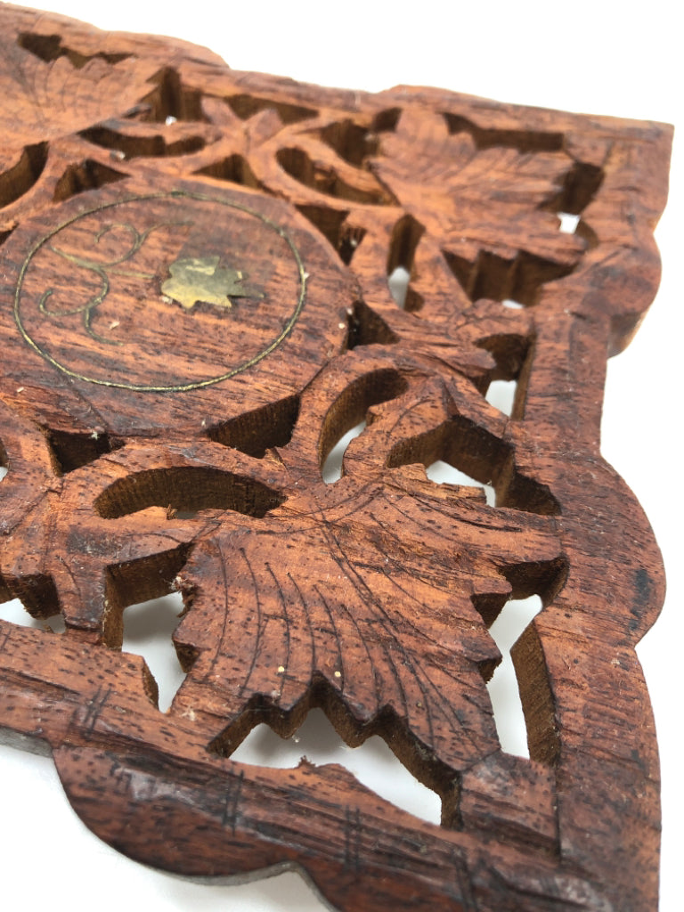 HAND-CARVED WOODEN TRIVET W/FLOWER CENTER.