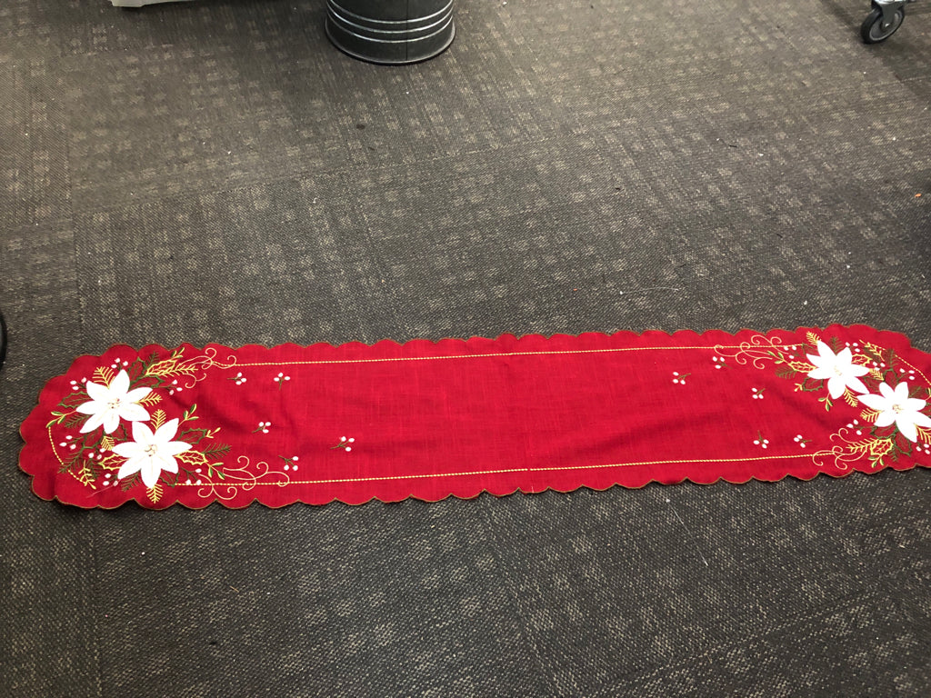 RED TABLE RUNNER W/WHITE POINSETTIA.