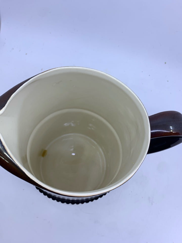 BROWN CERAMIC PITCHER.