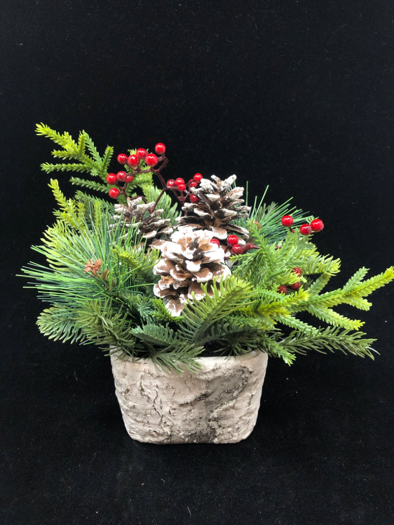 RED BERRY/PINE NEEDLES/FROSTED PINE CONES IN BARK CERAMIC VASE.