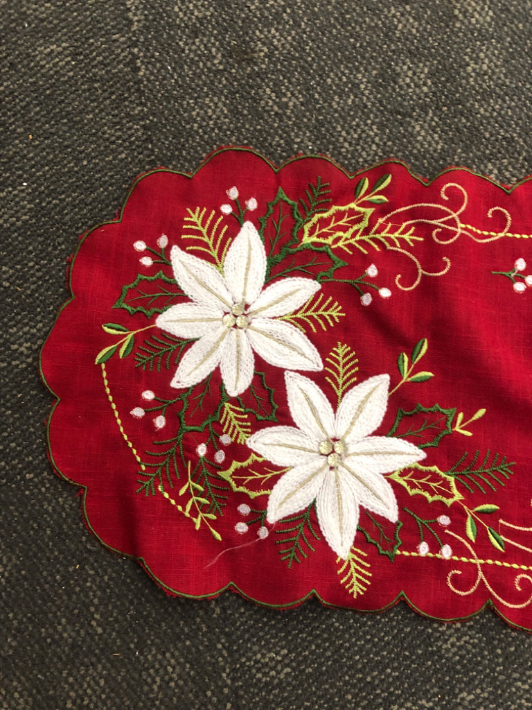 RED TABLE RUNNER W/WHITE POINSETTIA.