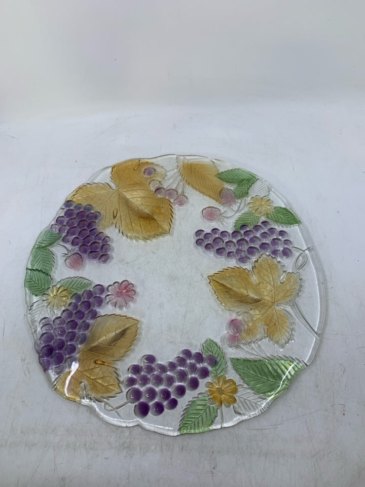 GLASS PLANTED W/ ASSORTED COLORED FRUIT.