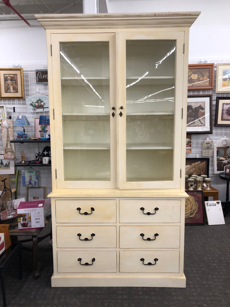 LARGE YELLOW/CREAM 2PC HUTCH 6 DRAWER 4 SHELF W GLASS DOORS AND BLACK HARDWARE.
