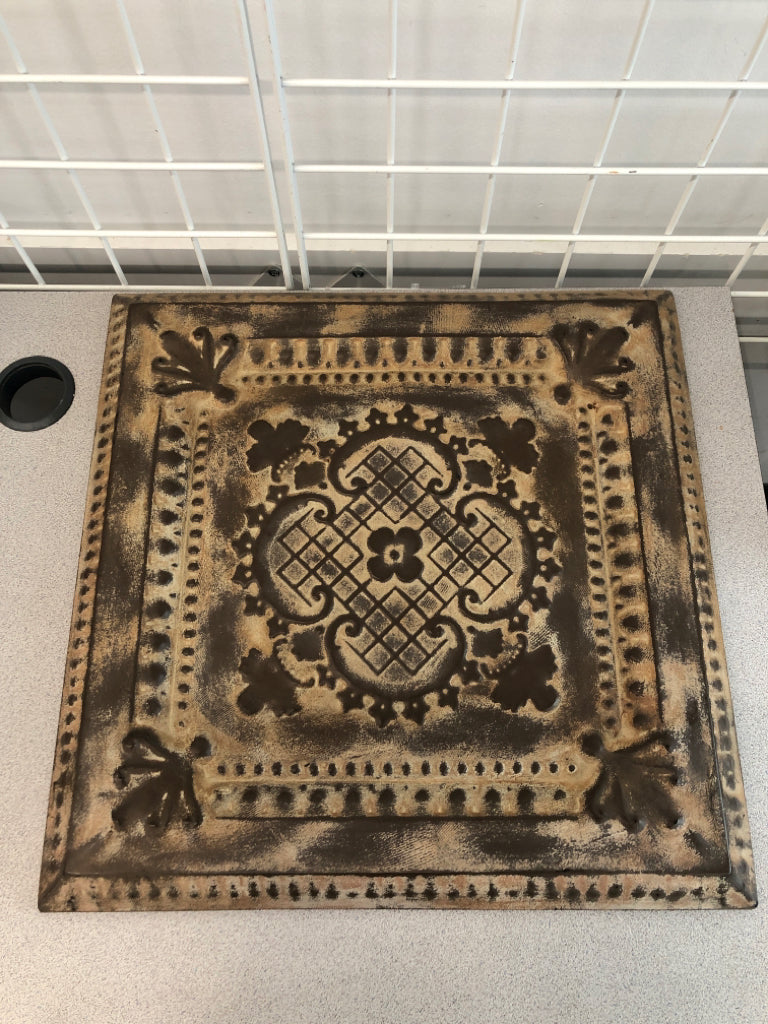 BROWN EMBOSSED METAL TILE.