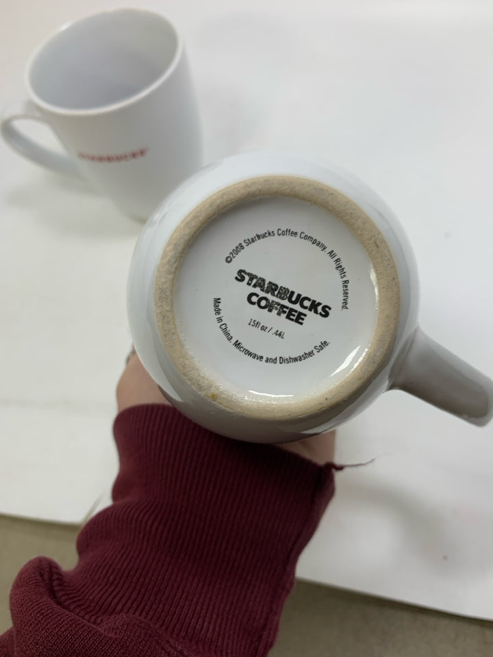 2 WHITE 2008 CERAMIC STARBUCKS MUGS IN RED WRITING.