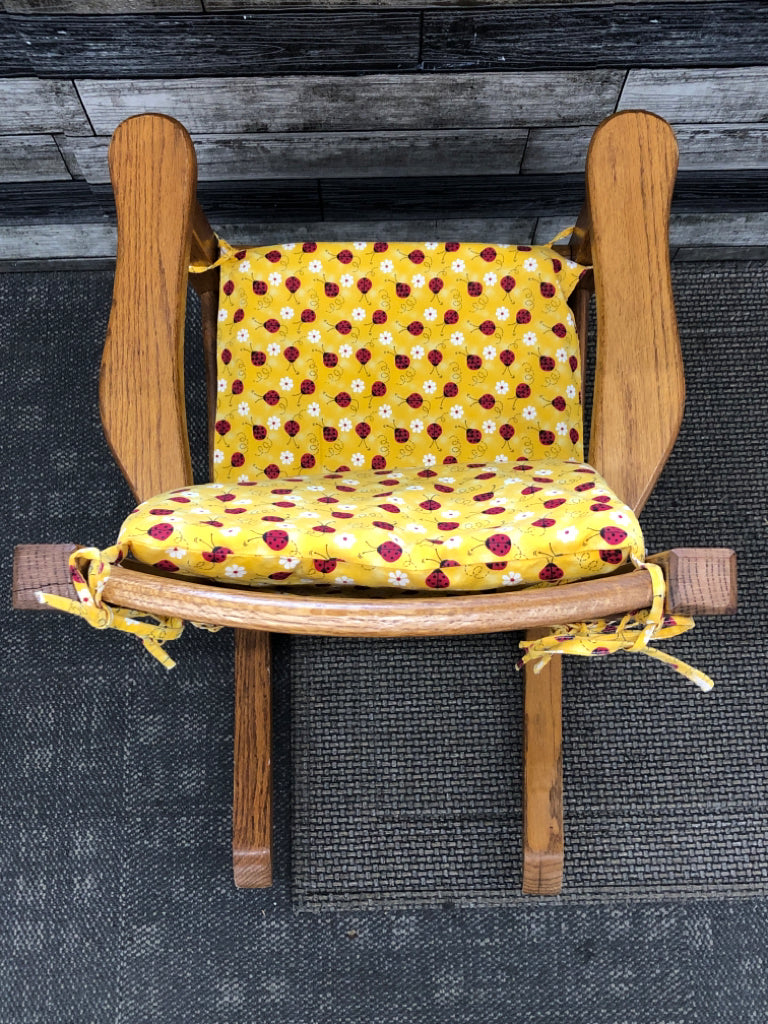VTG KIDS WOOD ROCKING CHAIR W/LADYBUG CUSHIONS.
