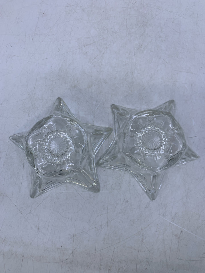 2 CLEAR GLASS STAR SHAPED TAPERED CANDLE HOLDERS.