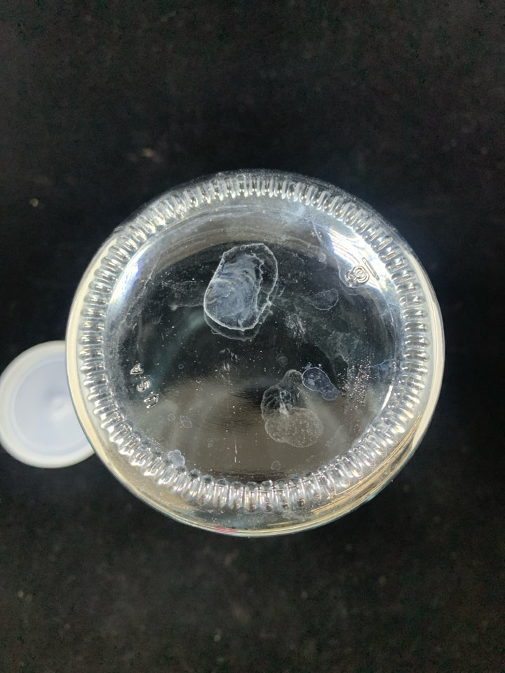 CARAFE W/EMBOSSED FLOWER AND PLASTIC LID.