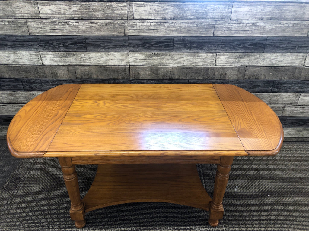 SOLID WOOD 2 TIER COFFEE TABLE W/ 2 DROP LEAF ENDS.