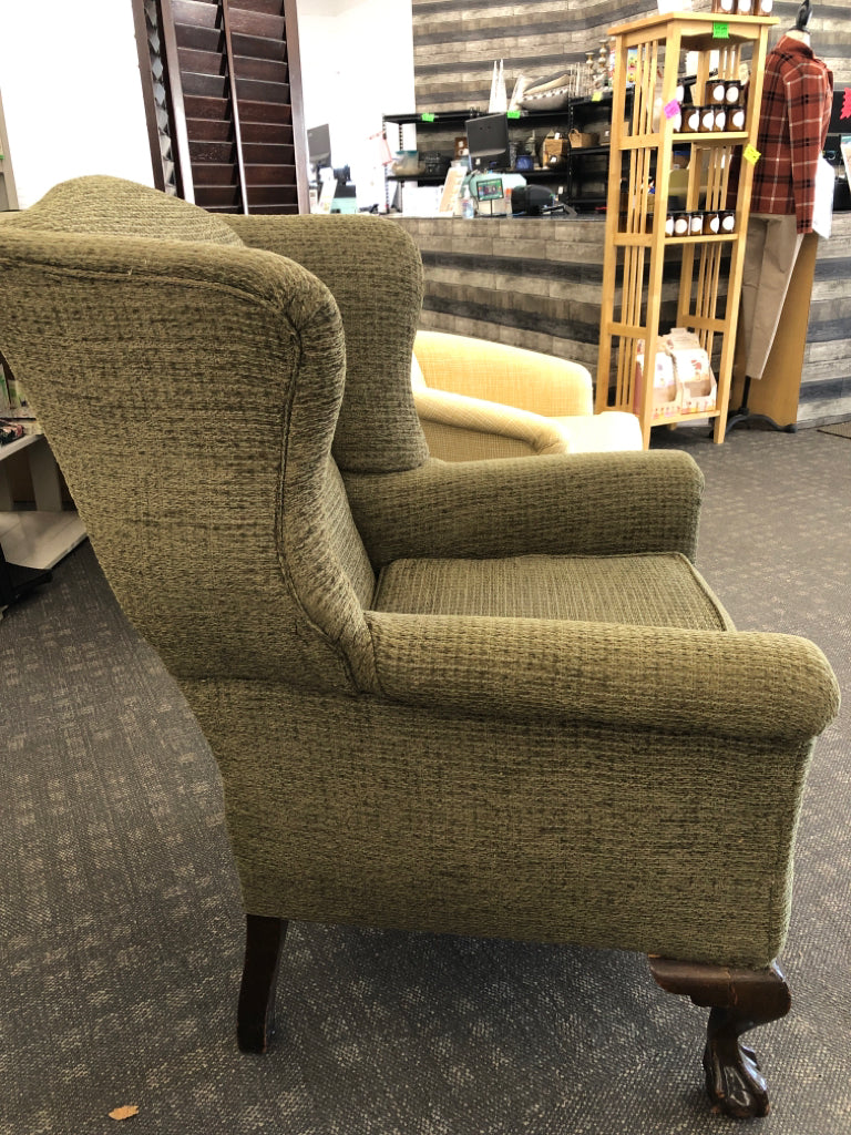 GREEN WING BACK CHAIR W DARK WOOD LEGS.