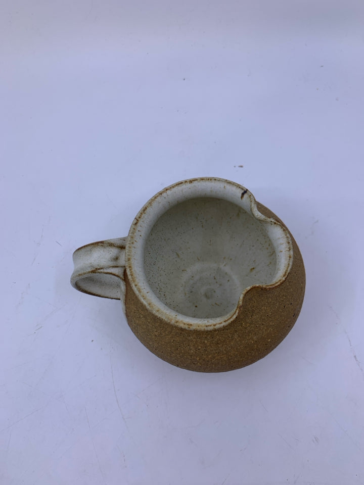 MATTE TAN CREAMER W/ WHITE SPECKLED SIDE/INSIDE POTTERY.
