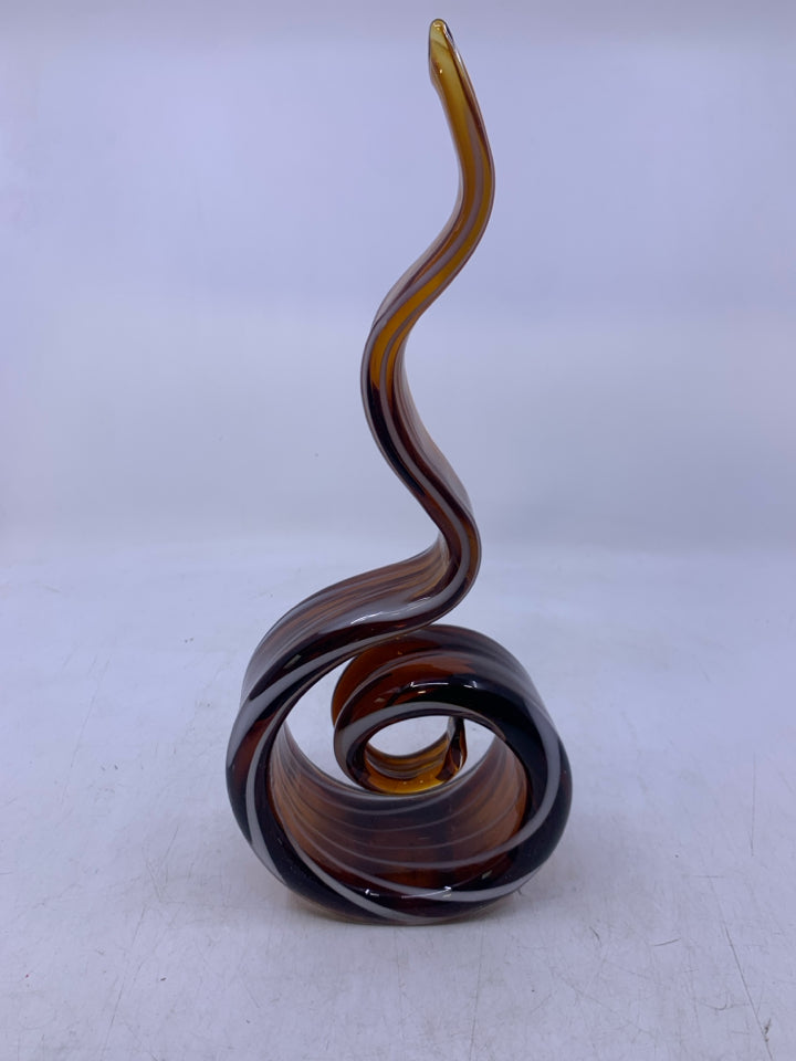 BROWN BLOWN GLASS SWIRL STANDING ABSTRACT PIECE W/ WHITE LINES.