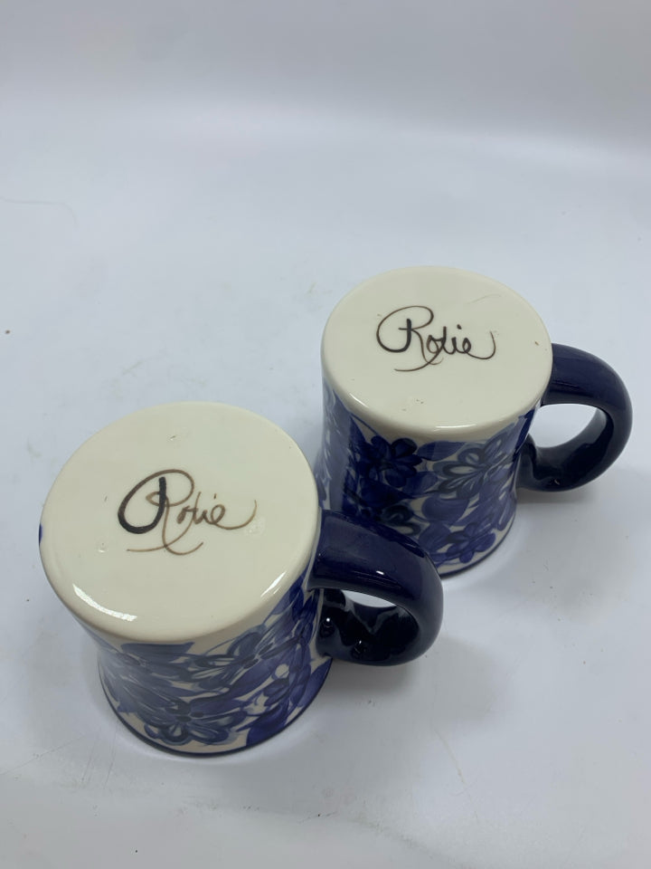 2 NAVY FLORAL PAINTED MUGS.
