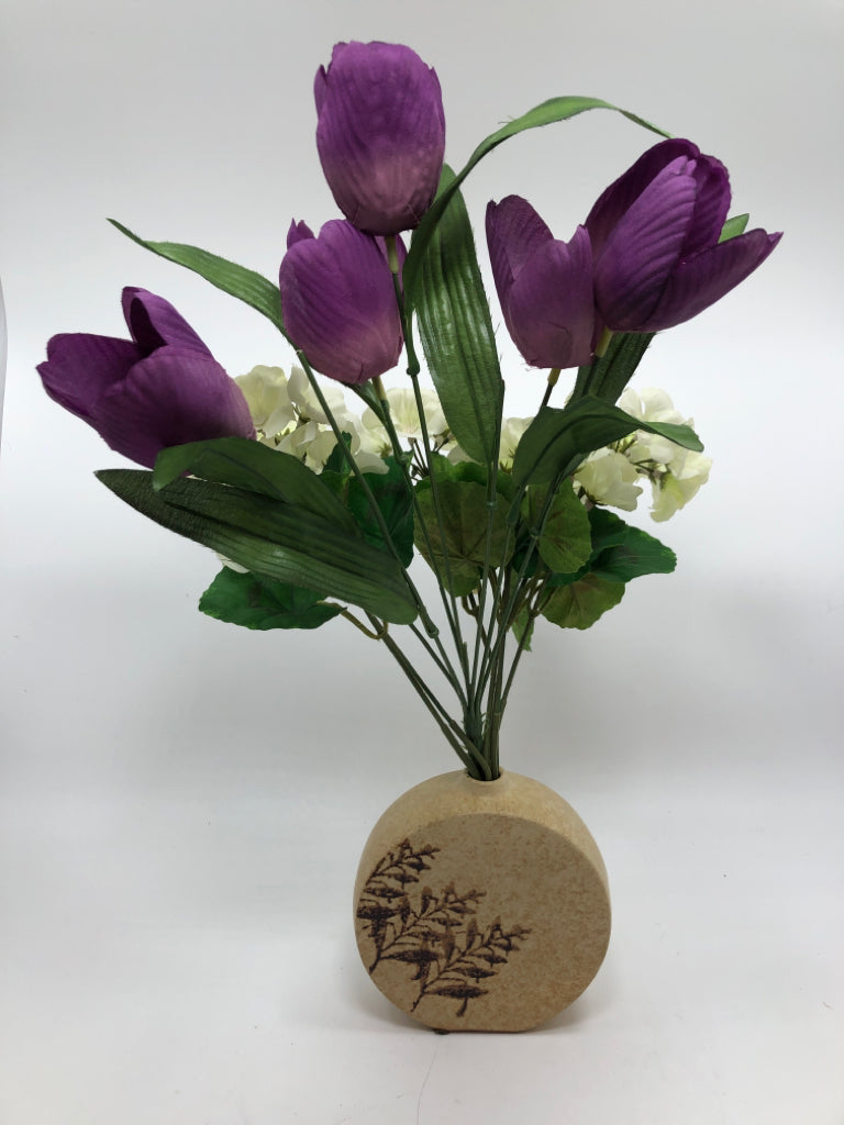 FAUX PURPLE TULIPS IN TAN ROUND VASE.