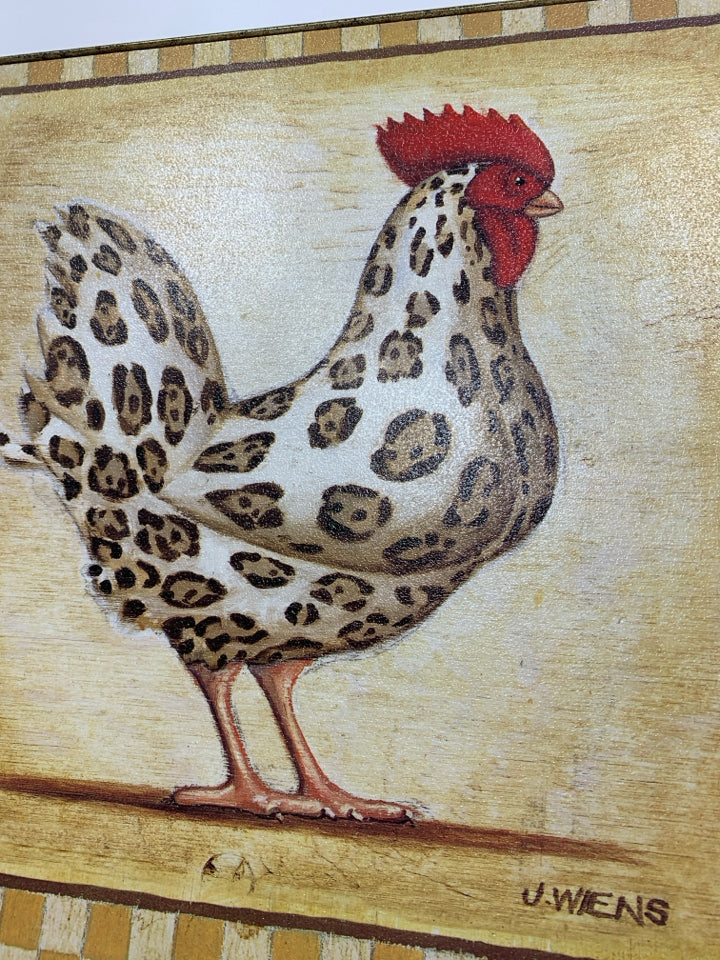 ROOSTER CANVAS IN BLACK PLASTIC FRAME.