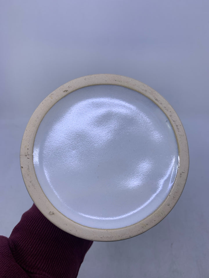 WHITE VASE W/ CARVED ARCHES HANDLE W/ SLATED NECK.