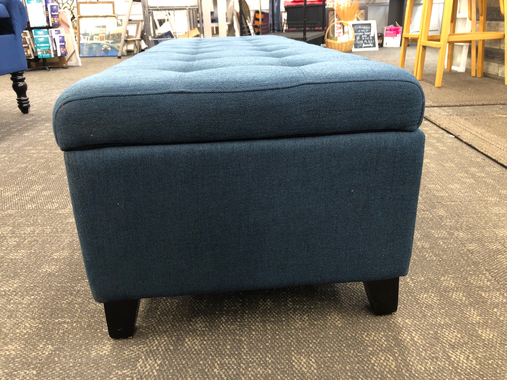 BLUE FABRIC STORAGE BENCH.