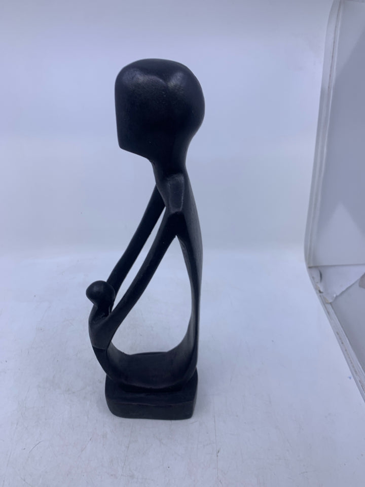 BLACK CARVED WOOD FOLK ART MAN & CHILD.