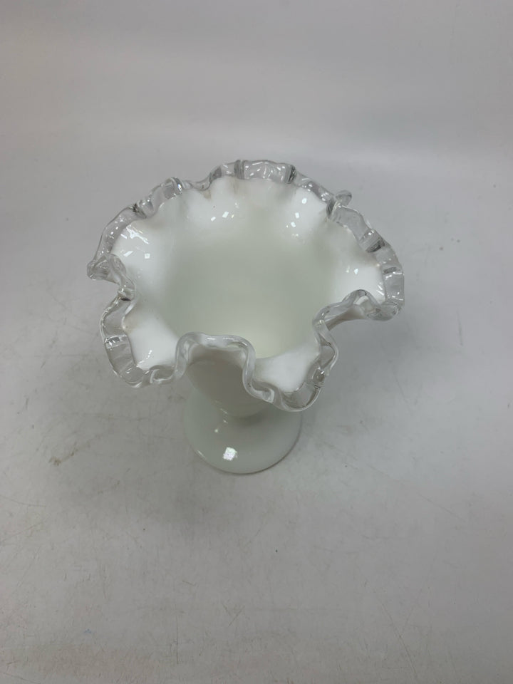 MILK GLASS FOOTED VASE W/ CLEAR RUFFLED EDGE.