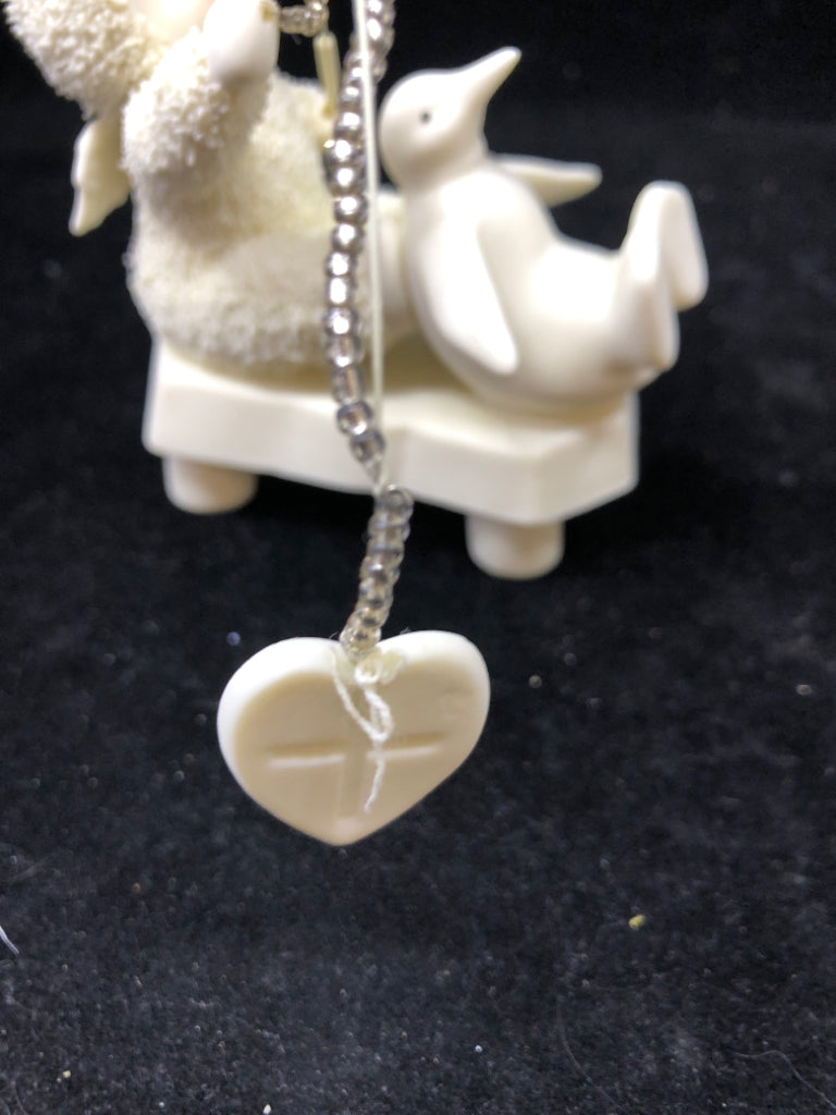 SNOW BABY A SERVANTS HEART HOLDING FISHING POLE.