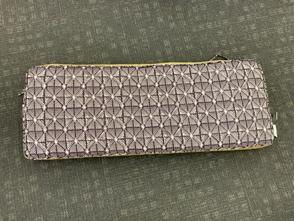 OUTDOOR BENCH SEAT CUSHION BROWN & WHITE PATTERN.