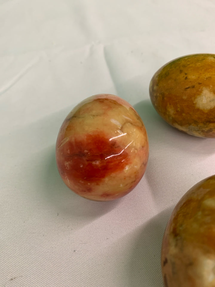 3 BROWN GLASS MARBLE EGGS.