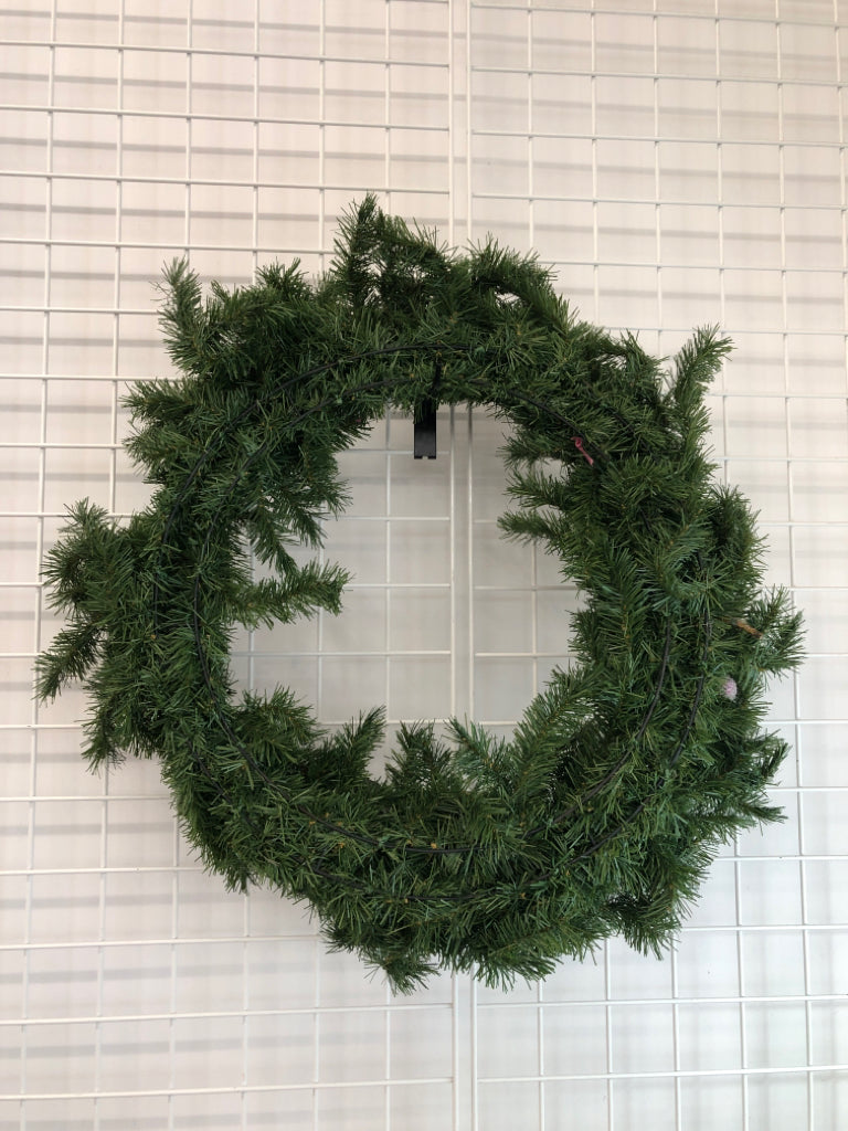 EVERGREEN WREATH W/PINK LEAVES.