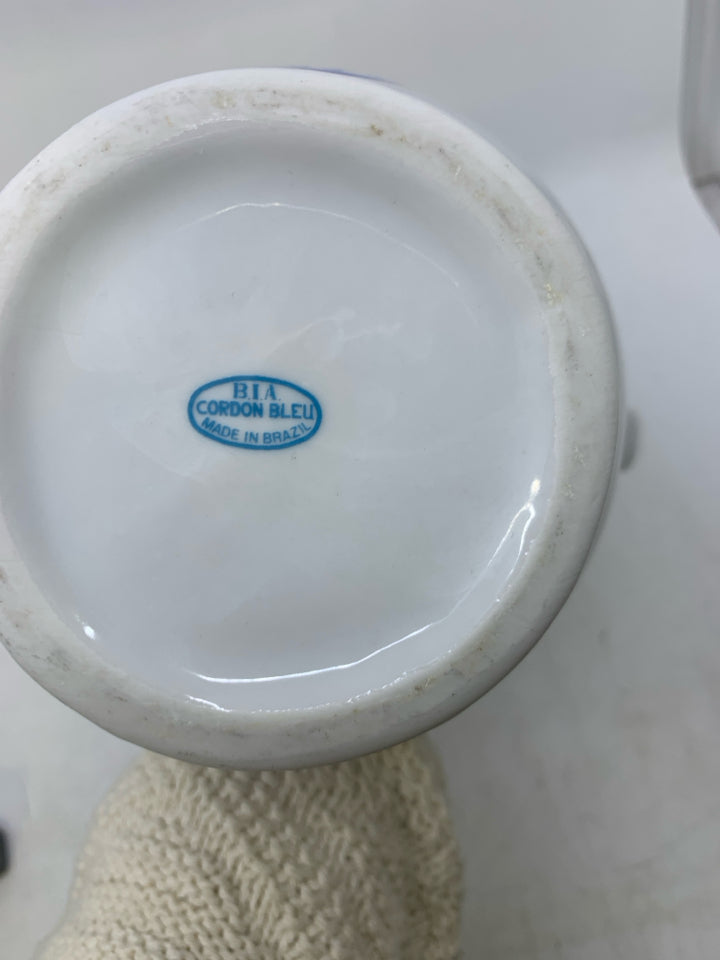 CERAMIC W/ ASSORTED BLUE UTENSILS.