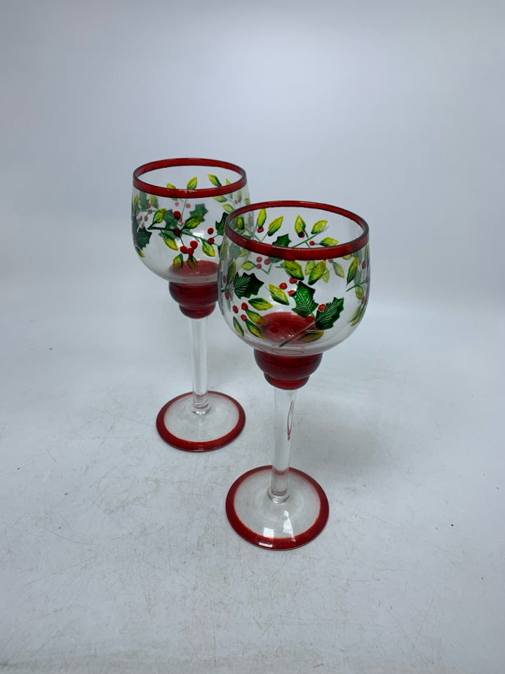 2 HOLLY/MISTLETOE PAITNED FOOTED CANDLE HOLDERS.